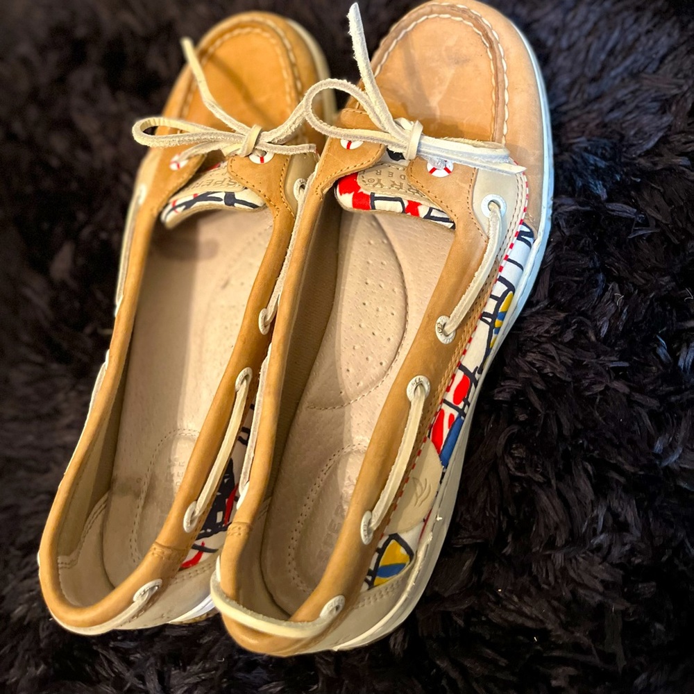 Sperry top-sider boat shoes. Light brown leather with red white and blue fabric